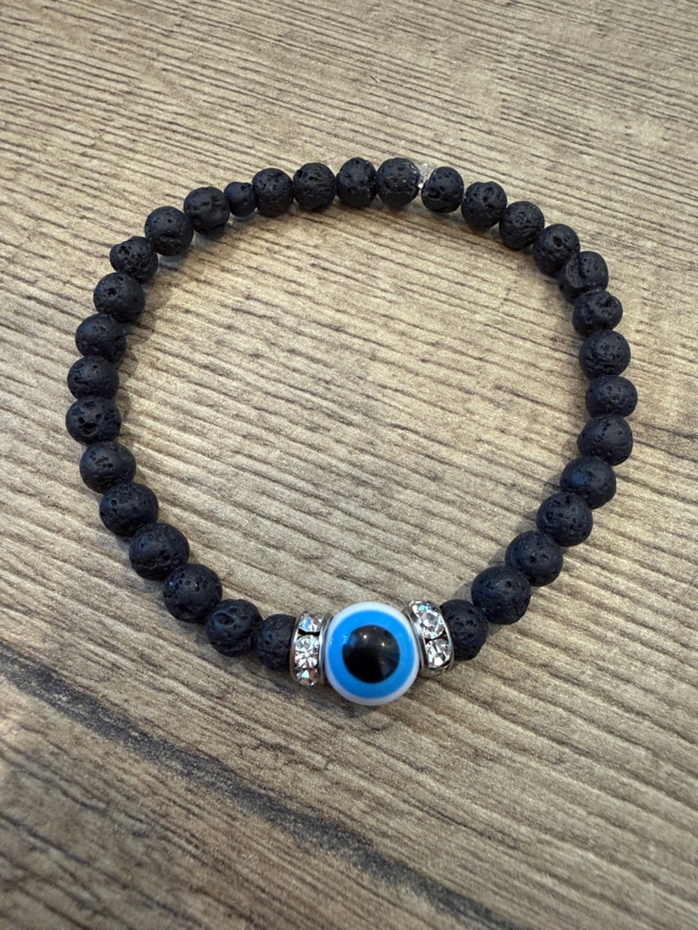 Black Lava Bead Bracelet with Blue Evil Eye Accent and Rhinestone Spacers